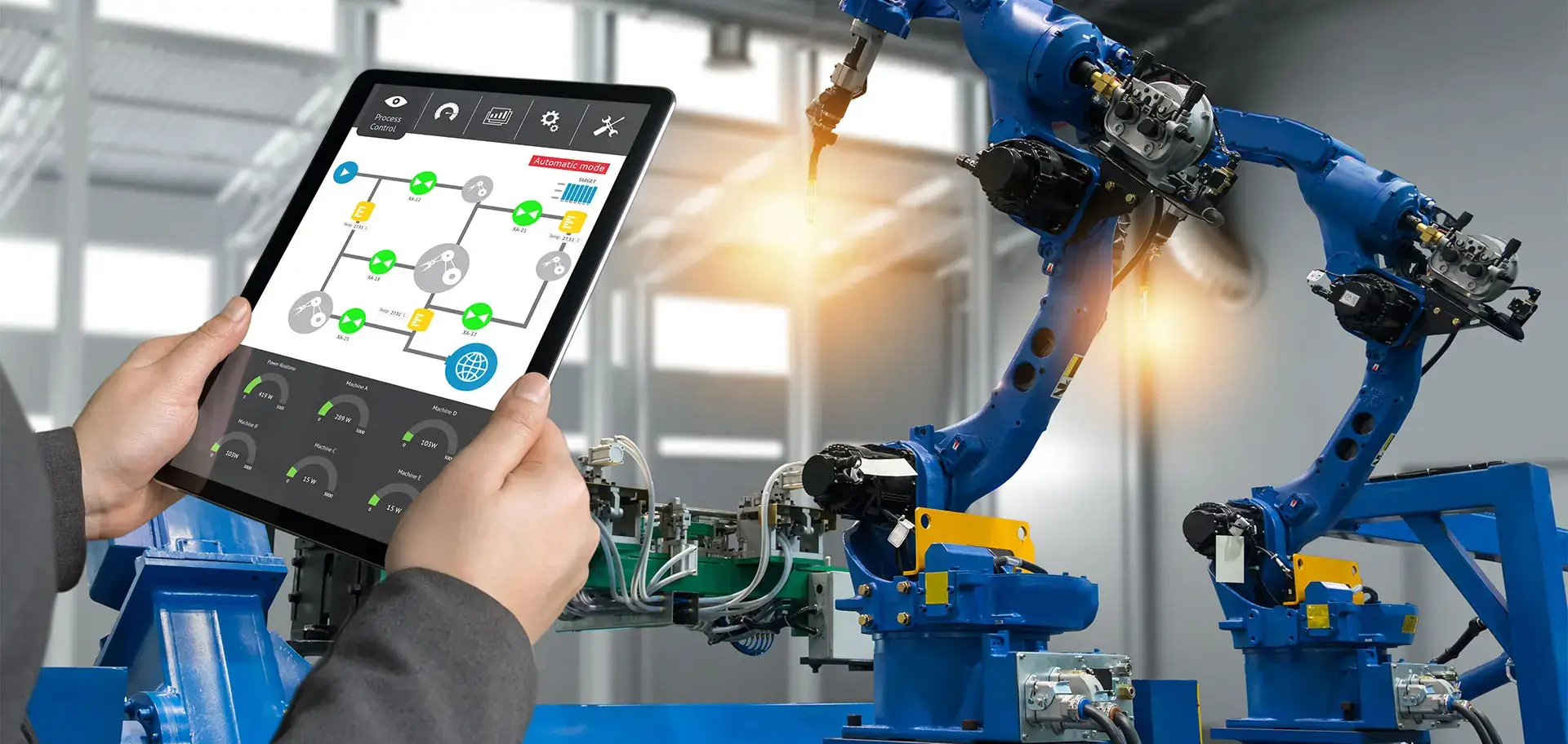 Engineer hand using tablet, heavy automation robot arm machine in smart factory industrial with tablet real time process control monitoring system application.